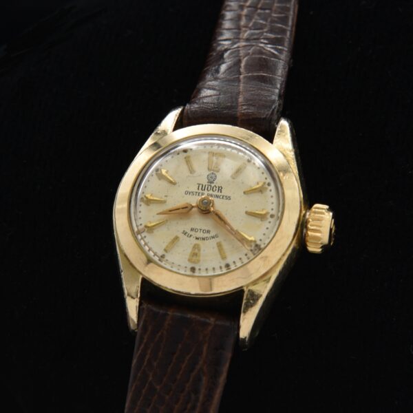 1950s Tudor Oyster Princess gold-filled ladies watch with original case, dial, numerals, Dauphine hands, and butterfly automatic movement.