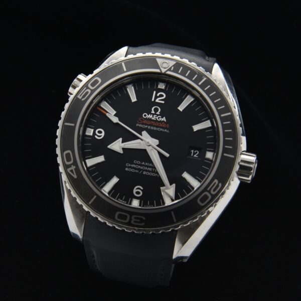 2009 Omega Seamaster Planet Ocean stainless steel watch with original crystal, rubber band, black dial, and caliber 8500 coaxial movement.