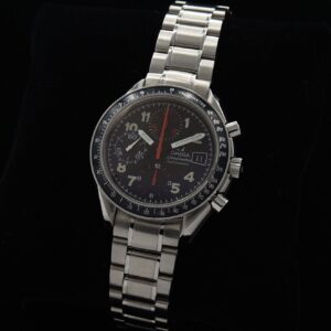 1998 Omega Speedmaster stainless steel chronograph watch with original pencil hands, bezel, racing-style dial, and caliber 1152 movement.