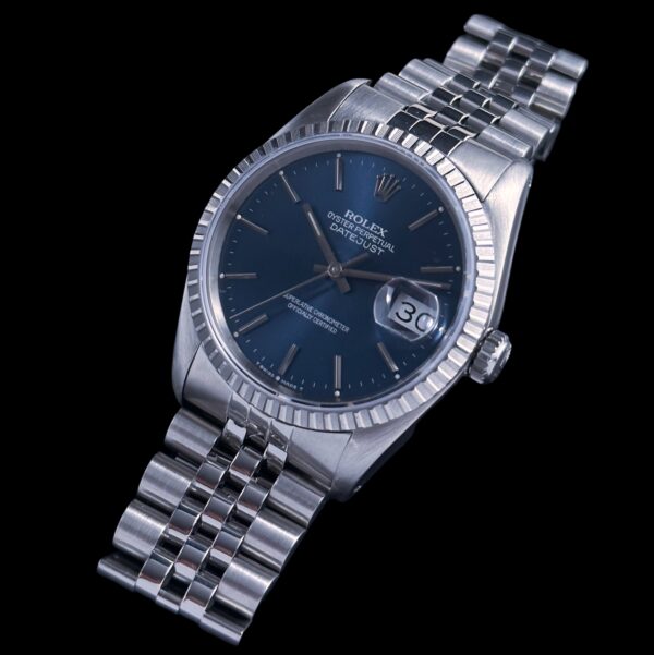 1991 Rolex Datejust stainless steel watch with original blue dial, Jubilee bracelet, quickset date feature, and clean caliber 3135 movement.