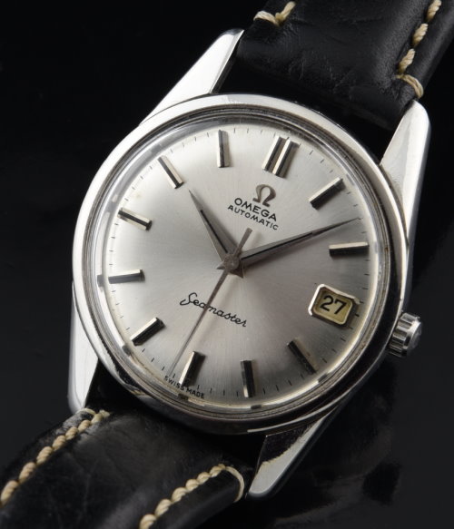 1961 Omega Seamaster stainless steel watch with new seals, original case, extended lugs, dial, and accurate caliber 562 automatic movement.