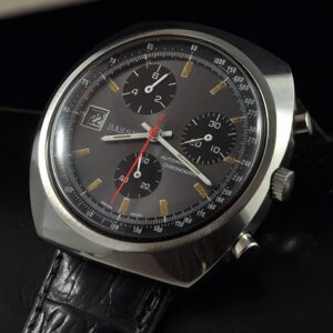 1970s Bassei stainless steel chronograph watch with original slate-grey dial, hands, case, and caliber 1369 automatic winding movement.