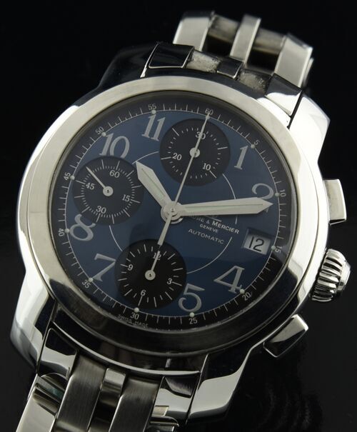 Baume & Mercier Capeland stainless steel chronograph watch with original blue dial, Arabic numerals, and Valjoux 7750 automatic movement.