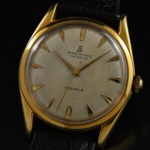 1960s Breitling dress watch with original gold-plated steel back, dial, raised Arabic markers, Dauphine hands, and manual winding movement.