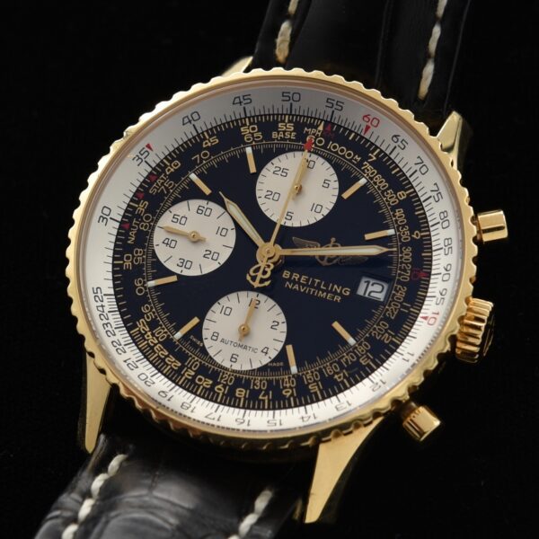 Breitling 41.5mm Navitimer 18k solid-gold watch with original box, papers, band, buckle, sapphire crystal, and automatic winding movement.
