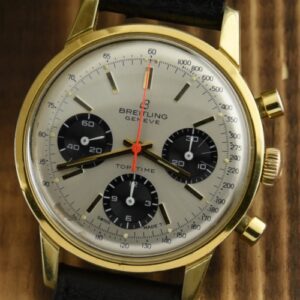 1960s Breitling 38mm Top-Time stainless steel watch with original gold-filled case, aged dial, crown, and Venus 178 manual winding movement.
