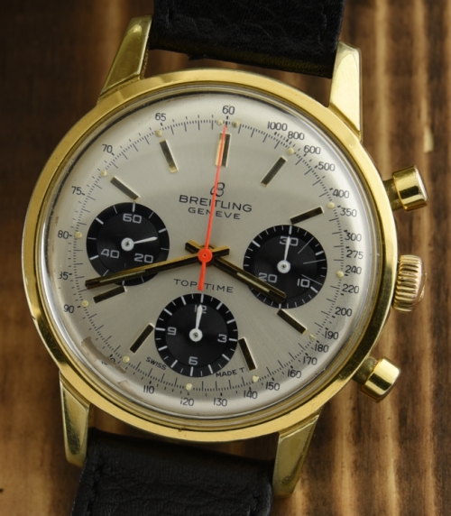 1960s Breitling 38mm Top-Time stainless steel watch with original gold-filled case, aged dial, crown, and Venus 178 manual winding movement.