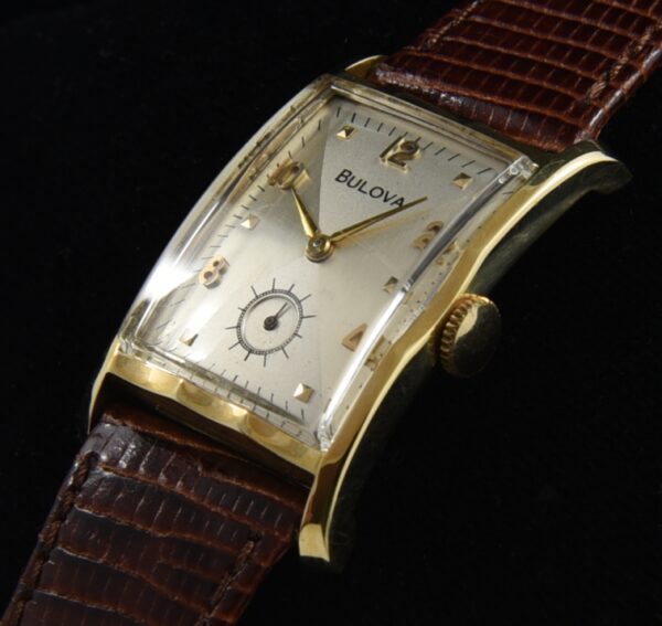 1952 Bulova 14k gold watch with original case, restored bowtie dial, raised numerals, markers, and clean, accurate manual winding movement.