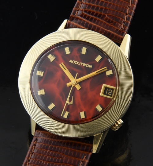 1973 Bulova 33.8x36.7mm Accutron 14k gold watch with original wide reeded bezel, marbelized dial, and recently serviced, cleaned movement.