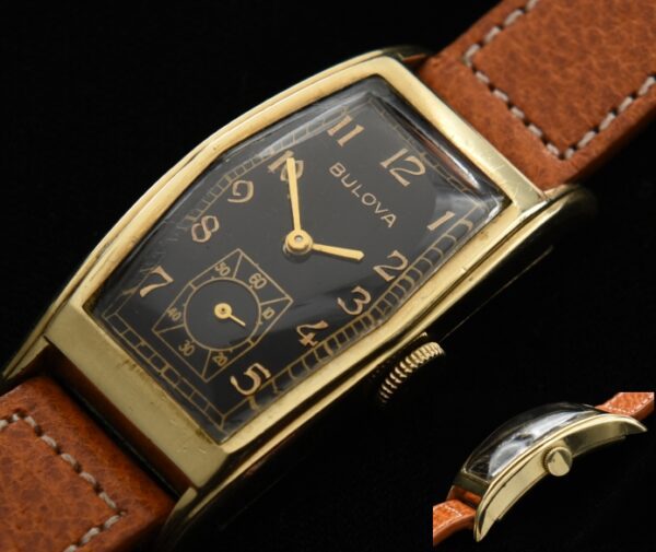 1940s Bulova 21x44mm gold-filled watch with original curved elongated case, clean black dial, Arabic numerals, and manual winding movement.