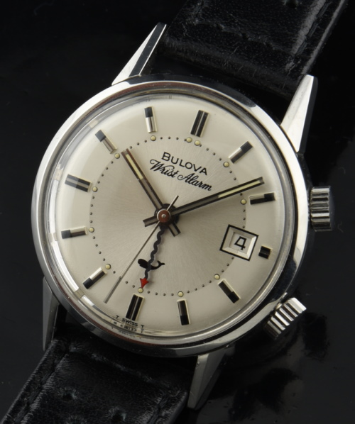1960s Bulova 34mm Wrist Alarm stainless steel new old stock watch with original pristine case, clean dial, and manual winding movement.