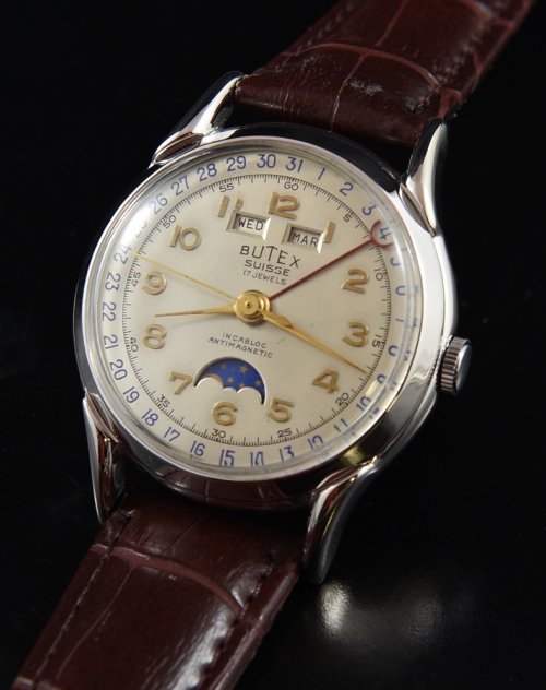 1950s Butex rhodium-plated watch with original moonphase complication, dial, horned lugs, and cleaned Valjoux 90 manual winding movement.