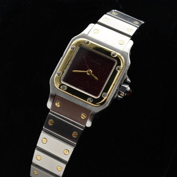 1990s Cartier Galbee 24mm ladies stainless steel watch with 18k gold bezel screws, Bordeaux colour dial, and automatic winding movement.