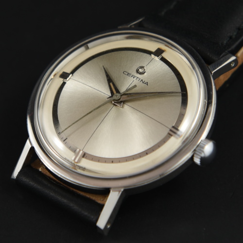 1960s Certina 34mm sleek and simple stainless steel watch with original reflective-track dial, Dauphine hands, and manual winding movement.
