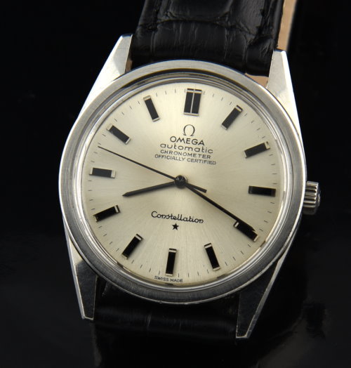 1966 Omega Constellation stainless steel watch with original case, winding crown, silver dial, and caliber 712 chronometer-grade movement.