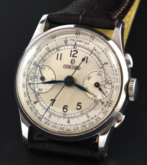 1940s Concord 32mm stainless steel chronograph watch with original case, oval pushers, bezel, dial, and cleaned manual winding movement.