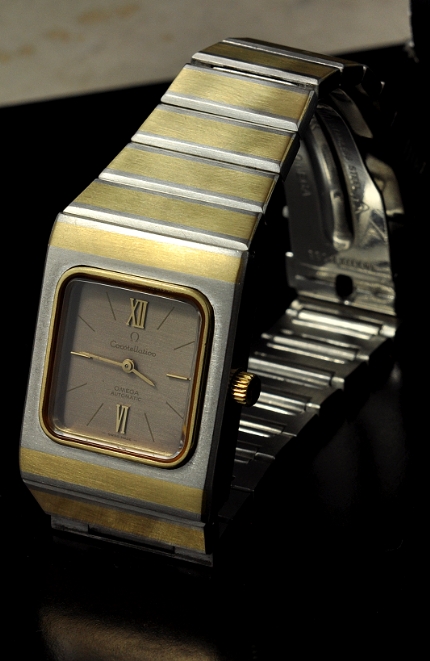 1980s Omega Constellation gold-plated stainless steel watch with original crown, case, bracelet, and cleaned automatic winding movement.