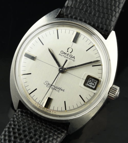1970s Omega Seamaster Cosmic stainless steel watch with original winding crown, crystal, silver dial, and clean automatic winding movement.