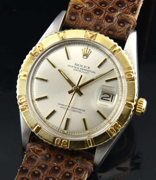 1974 Rolex Oyster Perpetual Datejust Thunderbird stainless steel watch with gold bezel, dial, hands, and caliber 1570 automatic movement.
