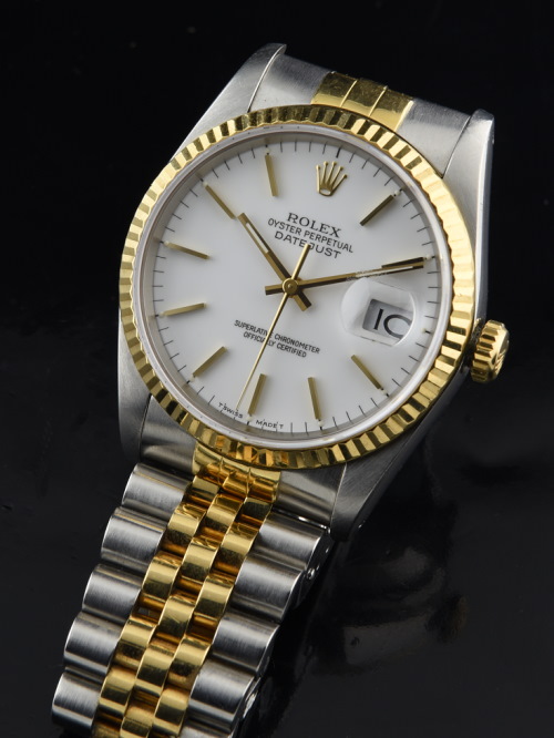 1987 Rolex Datejust 18k gold and steel two-tone watch with original case, bezel, Jubilee bracelet, white dial, and clean automatic movement.