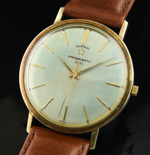 1960s Birks Eterna-Matic 3000 stainless steel watch with original dial, case, gold-clad bezel, and ball-bearing rotor automatic movement.
