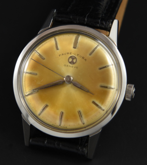 1962 Favre Leuba 33mm stainless steel watch with original Havana dial, Dauphine hands, winding crown, and cleaned manual winding movement.