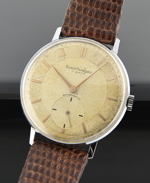 1945 Girard-Perregaux stainless steel watch with original textured dial, large sub-seconds, Dauphine hands, and manual winding movement.