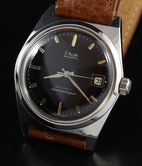 1964 D. Marthe Neuchatel stainless steel dive watch with original super-compressor case, glossy black dial, and ETA 2472 automatic movement.