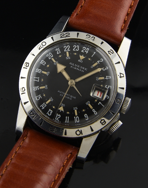 1950s Glycine Airman stainless steel military watch with original 24-hour black dial, lume, red date, and automatic winding AS movement.