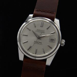 1960s Grand Seiko stainless steel watch with original unpolished case, screw-back emblem, hands, dial, and caliber 5722B manual movement.