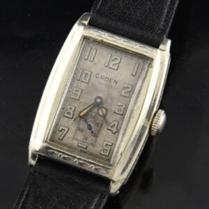 1930 Gruen 23.5x35mm Guild white-gold-filled watch with original filigree case, dial, hands, and cleaned, accurate manual winding movement.