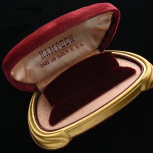 1950s Hampden watch box measuring 3.5x5" with plush burgundy velvet, silk and art deco plastic base. This watch box is very clean.