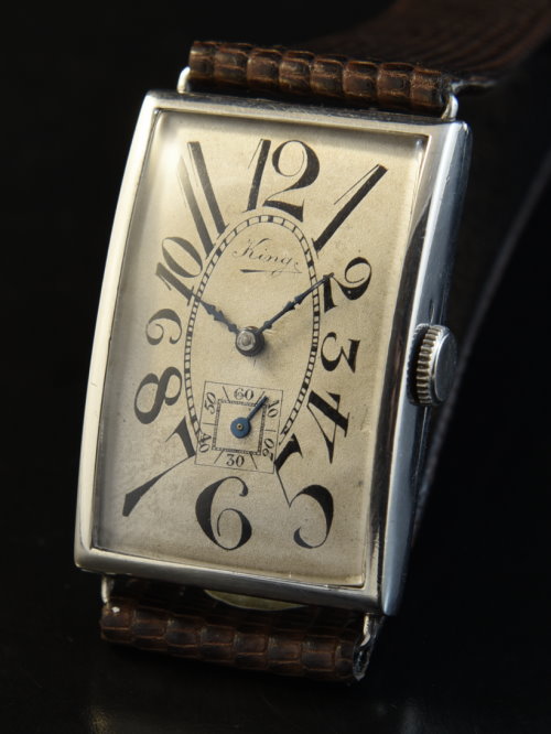 1920s Kings 25x44mm sterling-silver watch with original art-deco dial, exploding numerals, blued-steel hands, and manual winding movement.