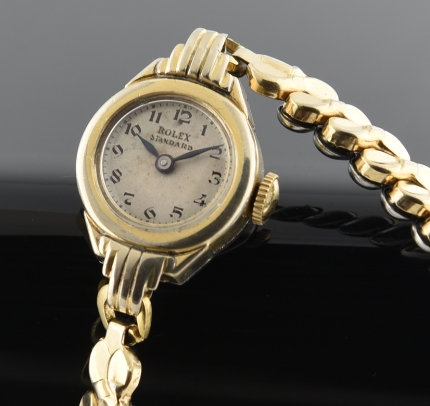 1940s Rolex Standard gold-filled ladies cocktail watch with original extended lugs, case, dial, and cleaned, signed manual winding movement.