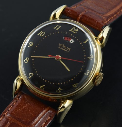 Jaeger-Lecoultre 32.5mm 14k solid-yellow-gold watch with original restored black dial, case, teardrop lugs, and cleaned automatic movement.