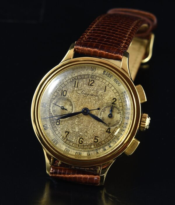 1941 Longines 18k gold chronograph watch with original case, dial, hands, signed crown, and cleaned caliber 13ZN manual winding movement.