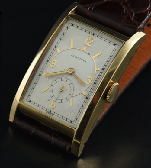 1937 Longines 40mm rectangular gold-filled watch with original pristine case, dial, raised markers, and restored art-deco Arabic numerals.