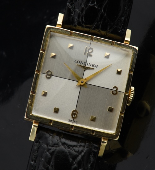1949 Longines 26x26mm 14k solid-gold watch with original eye-catching bowtie two-tone dial, case, and cleaned manual winding movement.