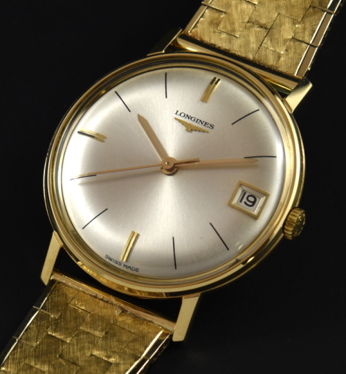 Longines 34mm 18k solid-gold watch with original unsigned 14k bracelet, pristine dial, signed crown, and cleaned manual winding movement.