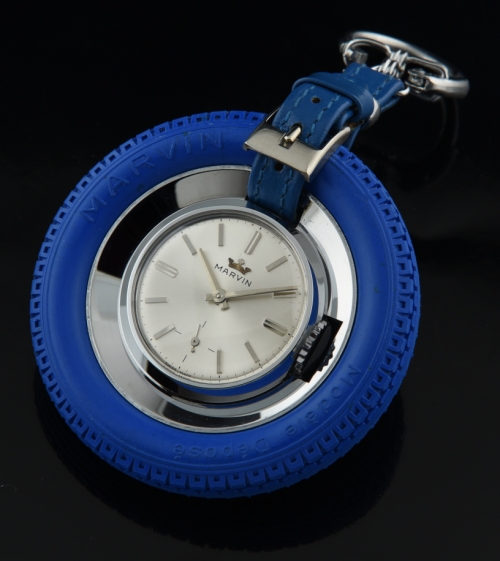 1960s Marvin Swiss blue-rubber-tire auto-racing pocket watch with original skeleton case back, leather band, and manual winding movement.