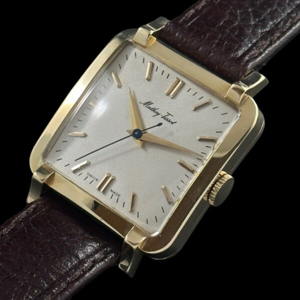 1950s Mathey-Tissot 14k solid-gold watch with original restored dial, markers, Dauphine hands, square case, and cleaned automatic movement.