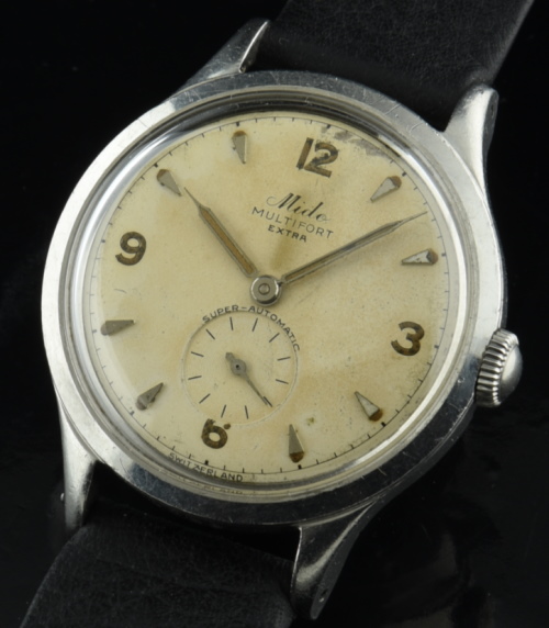 1950s Mido 34mm Extra Super Automatic stainless steel watch with original curled lugs, and Rolex-Explorer-configuration dial, pencil hands.