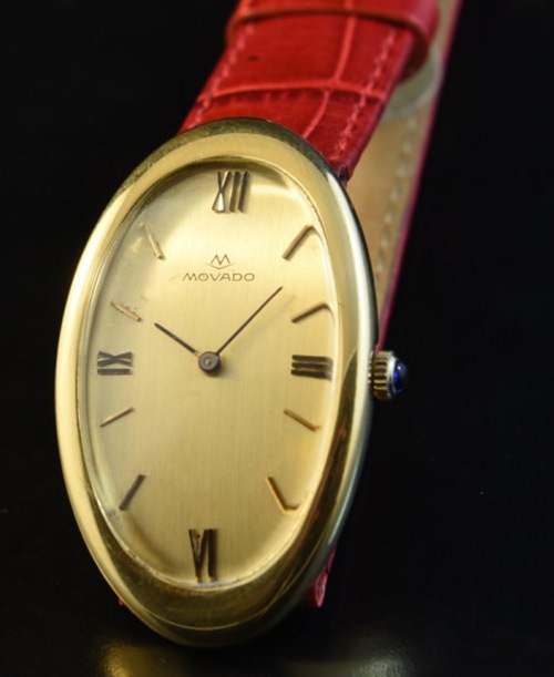 1970s Movado 24.5x41mm 18k solid-gold ladies watch with an original elliptical-shaped case, dial, and fine, cleaned manual winding movement.
