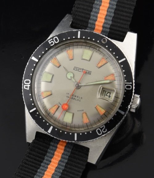 1970s Octus stainless steel watch with original turning bezel, orange/lime-green exotic dial, lollipop hands, and Elgin automatic movement.