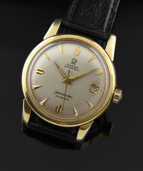 1956 Omega Seamaster Calendar gold-capped watch with original snap-back case, winding crown, restored dial, and clean caliber 502 movement.