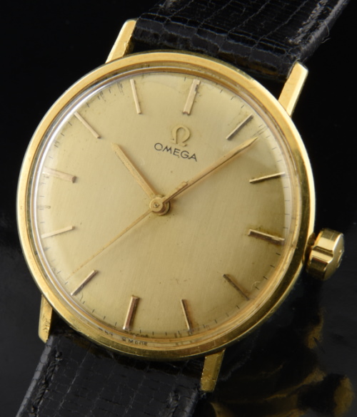 1966 Omega 18k solid-gold unpolished watch with original dial, needle hands, and fine, accurate manual winding caliber 601 gilded movement.
