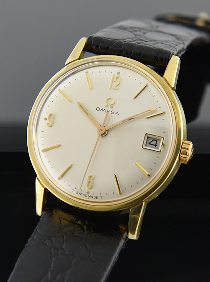1967 Omega Patek-Calatrava-like gold-plated watch with original case, winding crown, signed crystal, and cleaned manual winding movement.