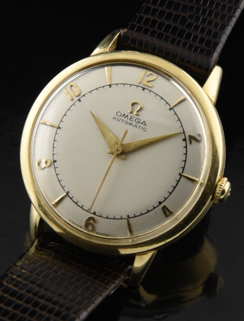 1950 Omega gold-filled watch with original restored dial, raised markers, Dauphine hands, and clean caliber 351 automatic winding movement.