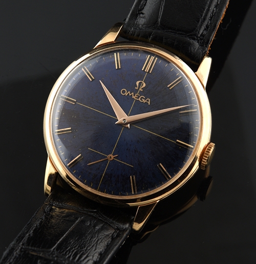 1957 Omega 18k rose-gold watch with original refinished azure-blue dial, case, crown, Dauphine hands, and clean caliber 267 manual movement.