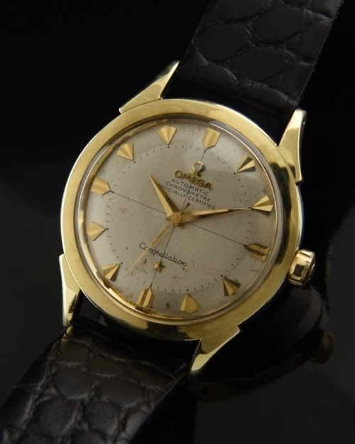 1954 Omega Constellation stainless steel watch with original silver dial, gold-toned markers, and caliber 354 chronometer-grade movement.